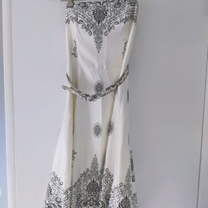 Belted strapless black and white silk like dress